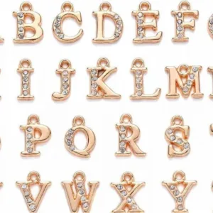 Dije piercing letra dorado